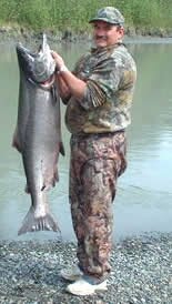 Photo of angler Mark Alderman of Wasilla, Alaska with a trophy Alaska king salmon caught on the Deshka River about 90 minutes north of Anchorage Alaska.